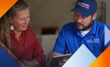 lancaster plumbing heating cooling and electrical employee talking to a customer