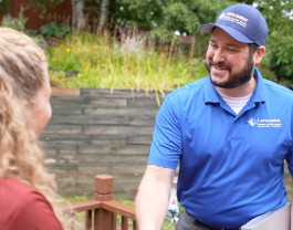 lancaster plumbing heating cooling and electrical technician shaking a customers hand