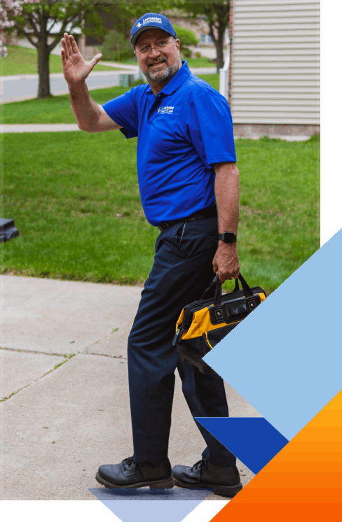 lancaster plumbing heating cooling and electrical employee waving goodbye after servicing a home