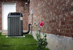 ac unit outside beside a brick house