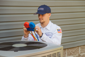 lancaster hvac technician inspecting an air conditioning unit