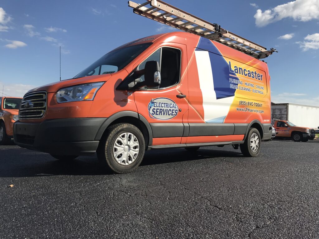 Lancaster Plumbing & Heating service van in a parking lot