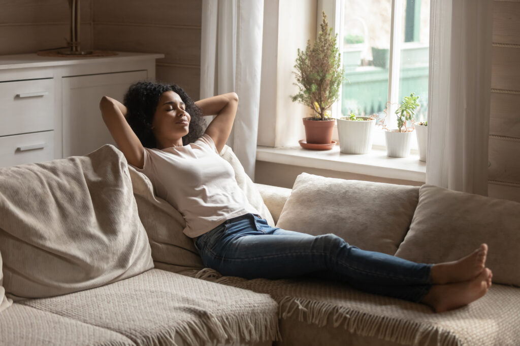 Homeowner relaxing by window